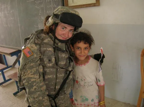 Female solider and little child