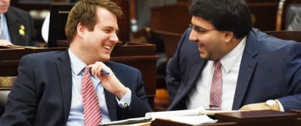 Two white men laughing