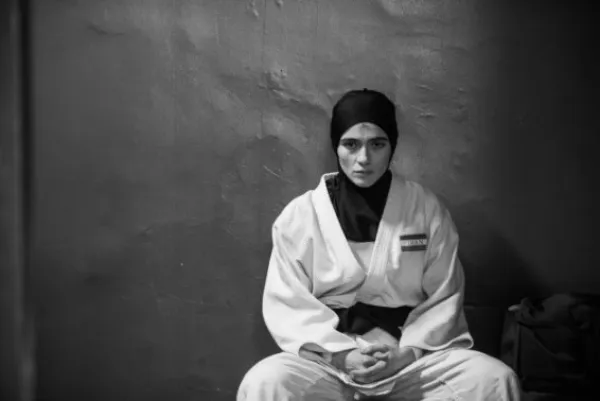 Person sitting in judo outfit