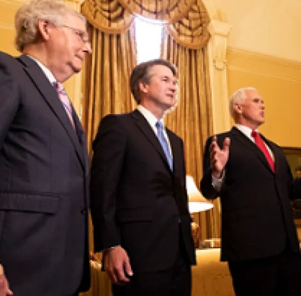 Three white guys in suits looking important