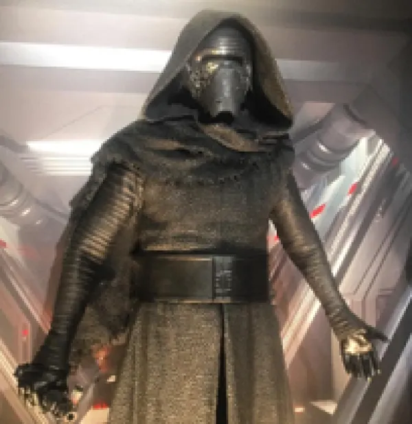 Guy in gold spacesuit looking outfit with helmet and facemask and hood from Star Wars