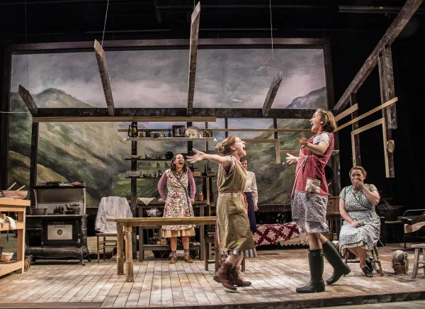 Scene from the play with a woman gesturing with mouth open 