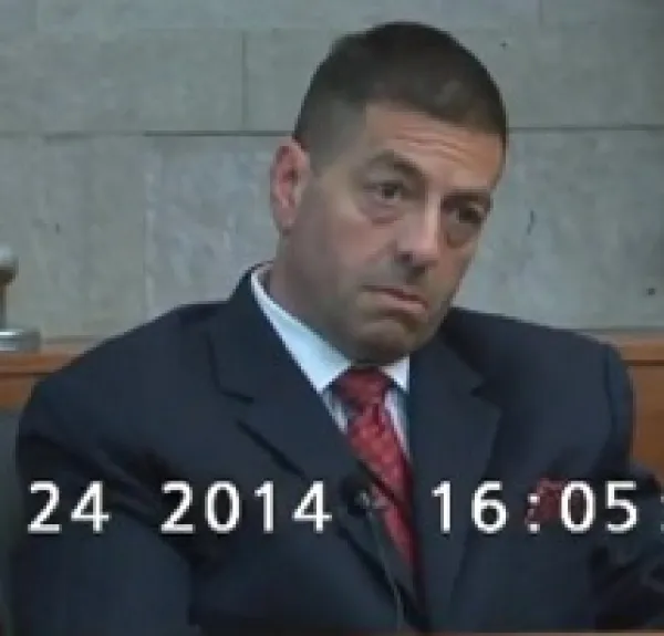 Older white man in a suit with a crew cut looking distraught with a date and time at the bottom 24 2014 16:05