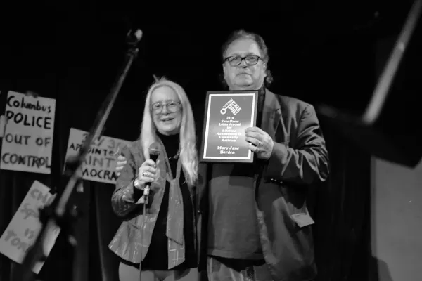 Bob and Mary Jane posing with plaque