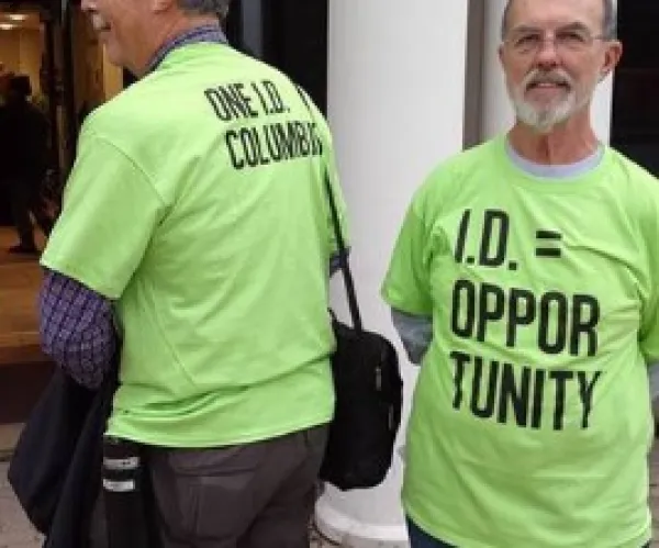 Two men wearing OneID T-shirts