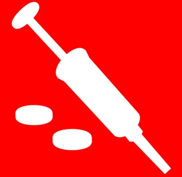 Syringe and pills
