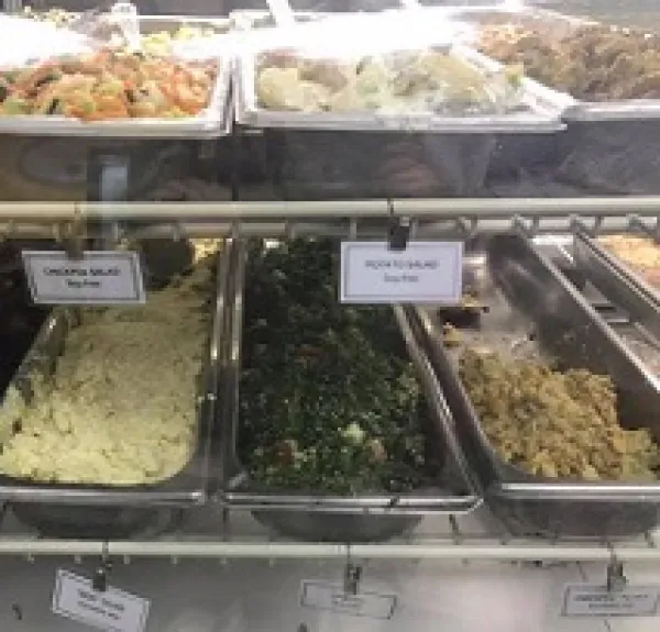 Lots of food in different trays all labeled