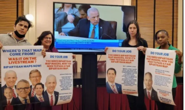 People holding signs