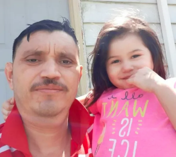 Latino man with little girl