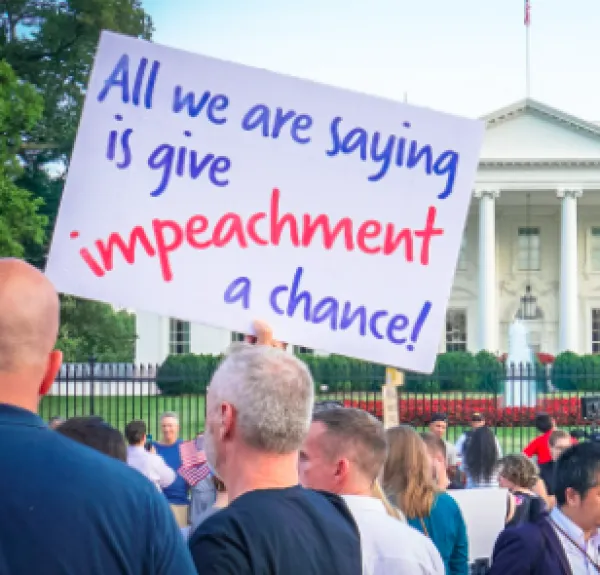 Sign saying All we are saying is give impeachment a chance