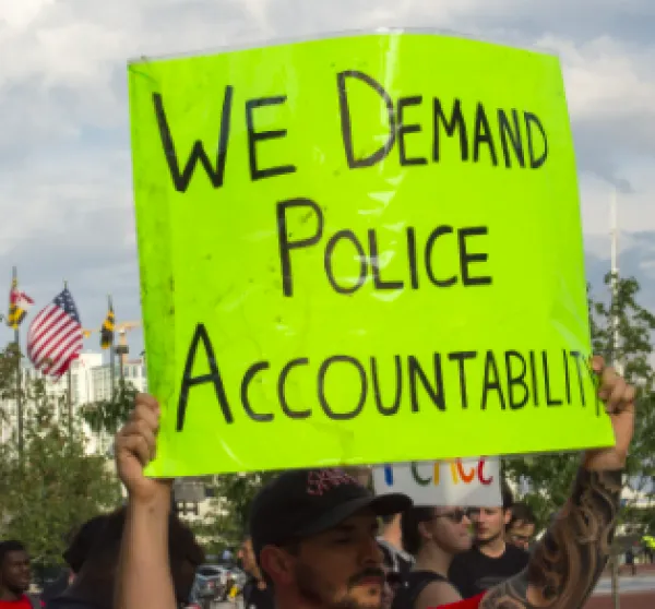 Sign saying We Demand Police Accountability