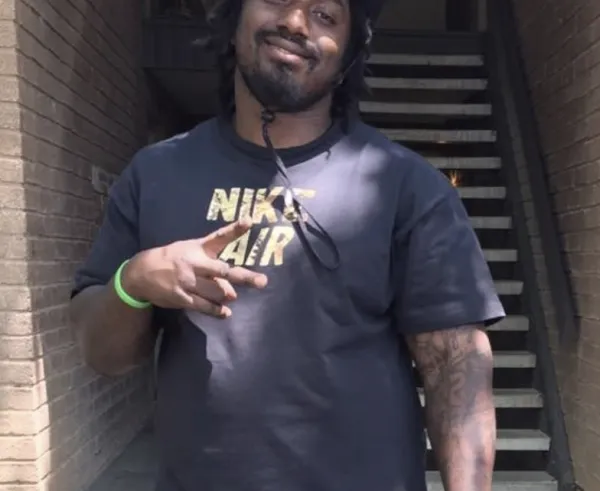 Man making peace sign