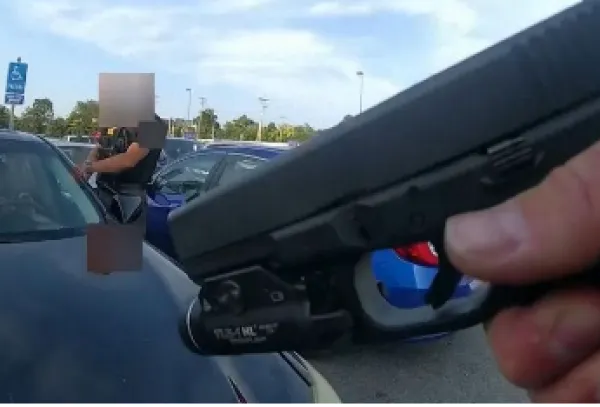 Gun aimed at car