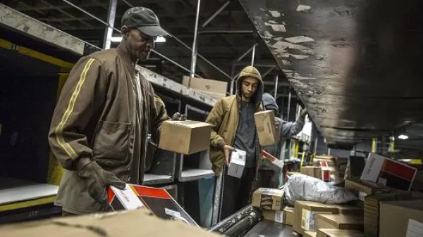 People working with boxes at UPS