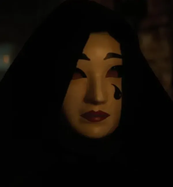 Face with white makeup and a tear on the cheek