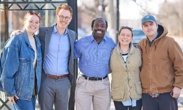 Jesse Vogel with four volunteers