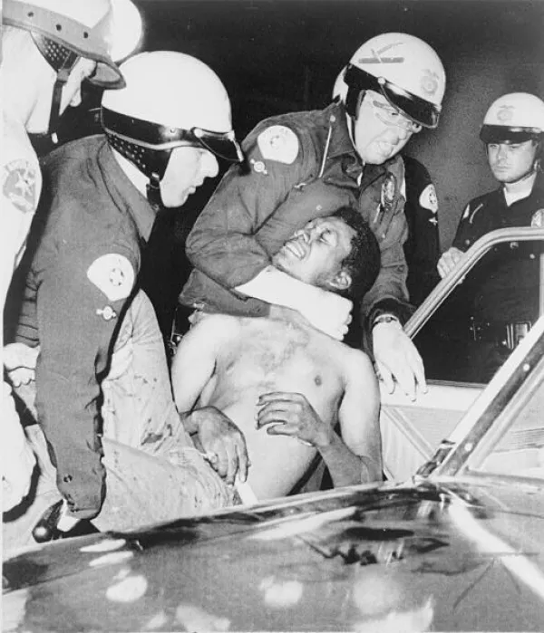 Police strangling a black man at Watts riot
