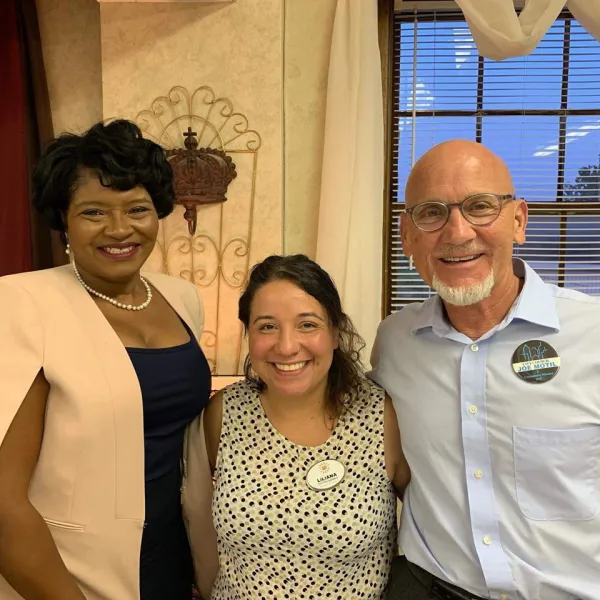 Three people, a black woman, a Latina woman and white man