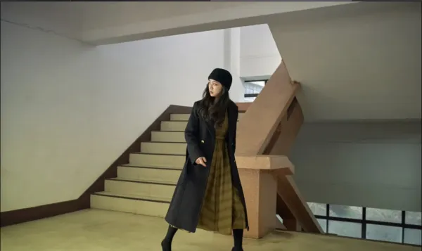 Woman walking and looking behind her