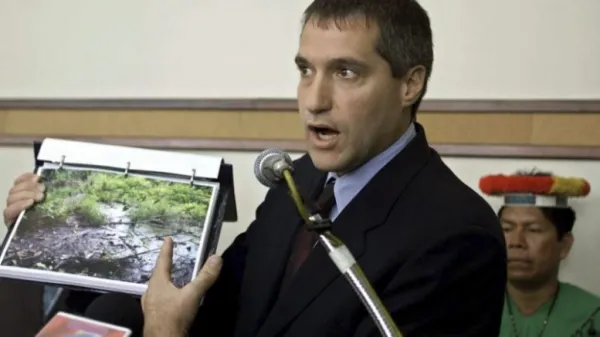 White man talking into a mic