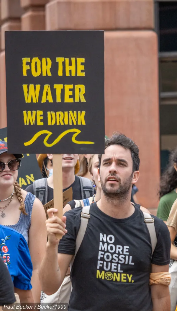 Man holding protest sign
