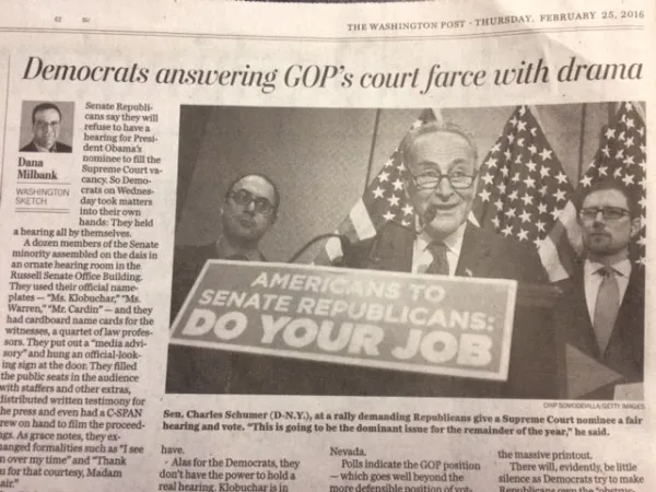 Picture of newspaper with people confronting politicians