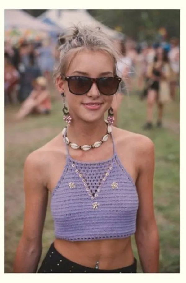 Young woman at outdoor festival wearing a shell necklace